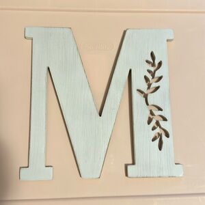 Wooden M sign